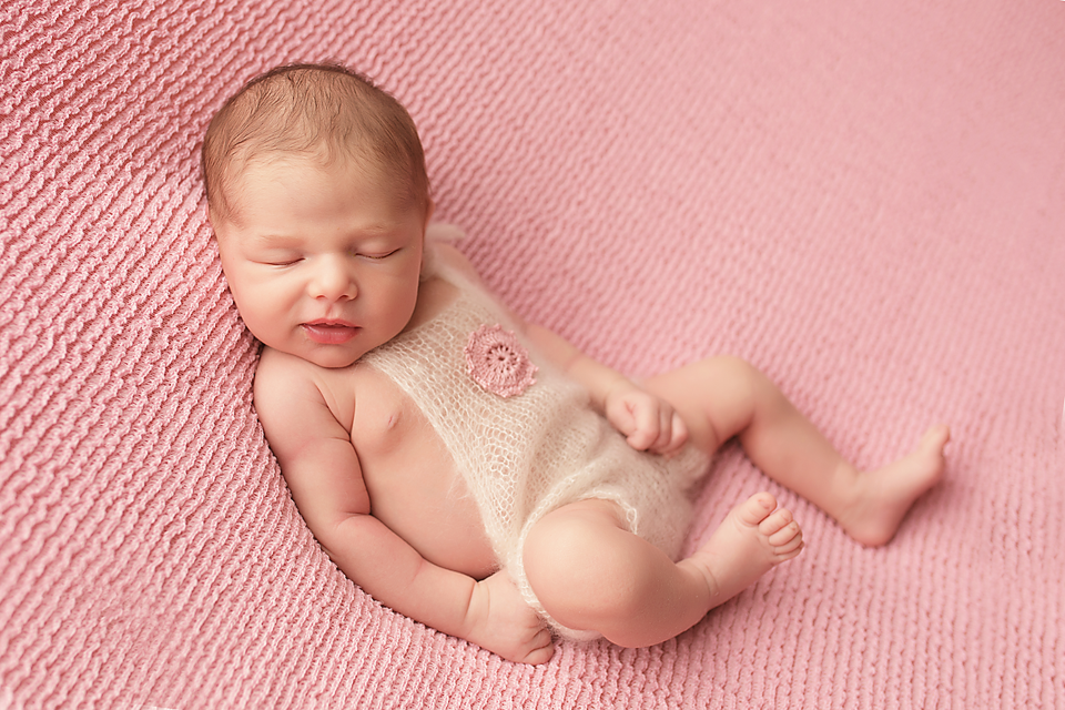 high bridge newborn baby girl on pink 