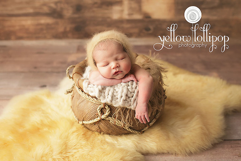 newborn baby in yellow