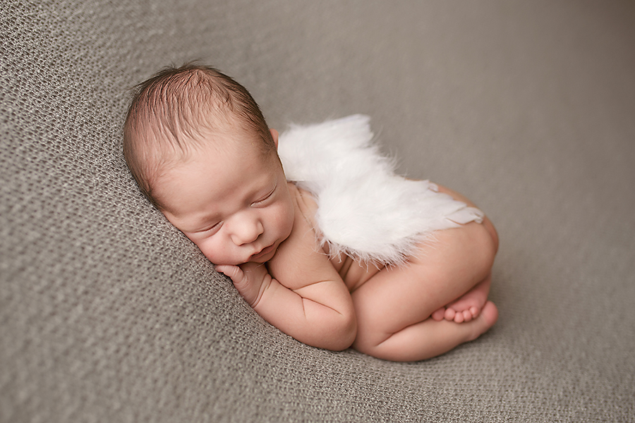 baby boy with angel wings newborn photo session 