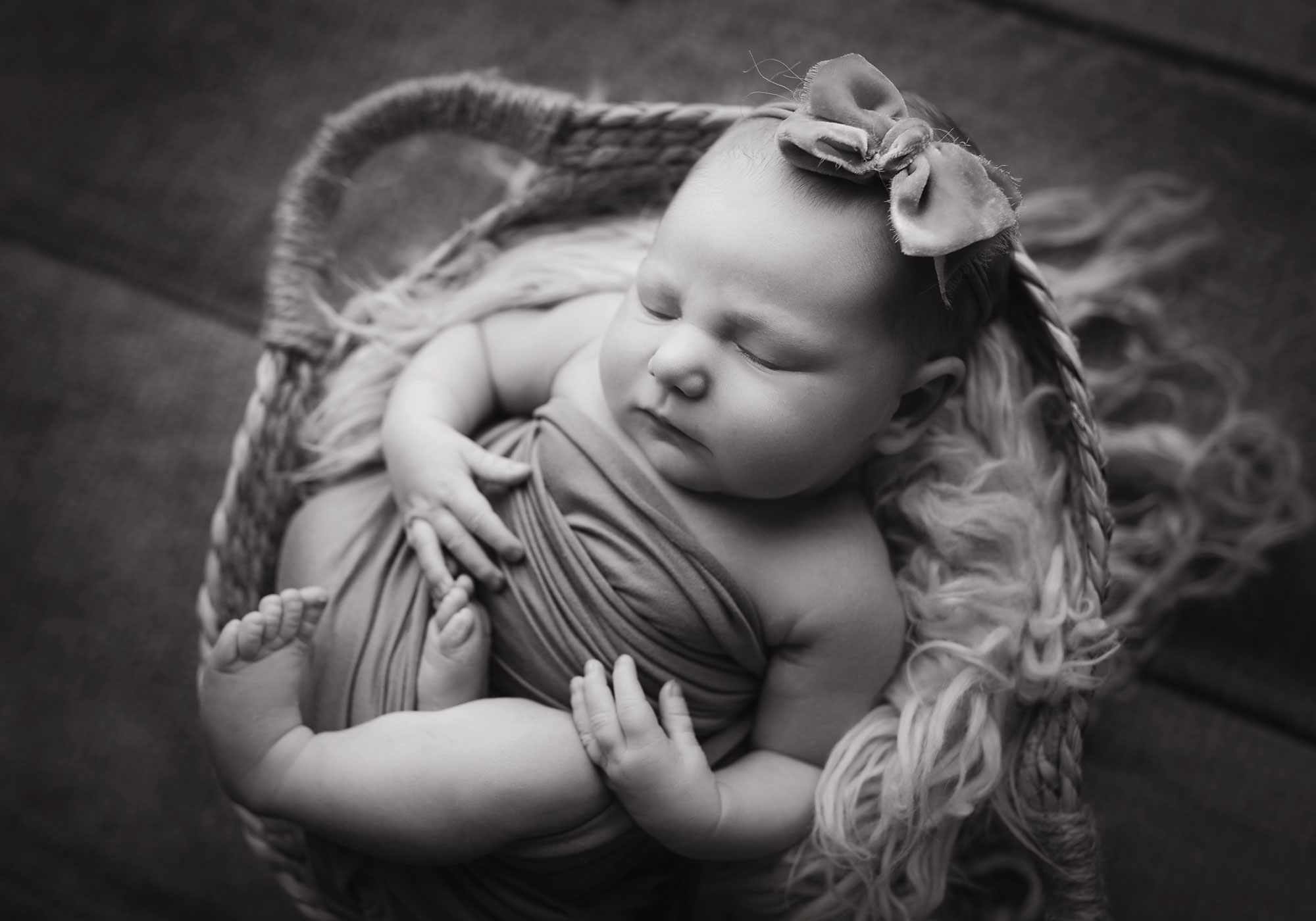 best middlesex county nj newborn photographer sleepy baby in a basket black and white photo