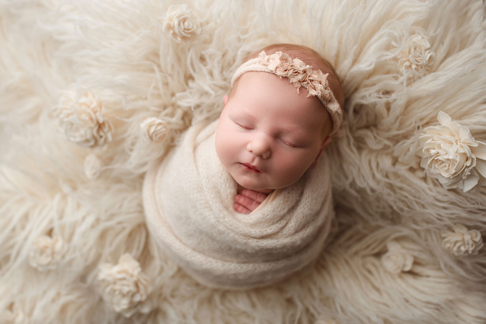 baby on a white flokati best middlesex county nj newborn photographer