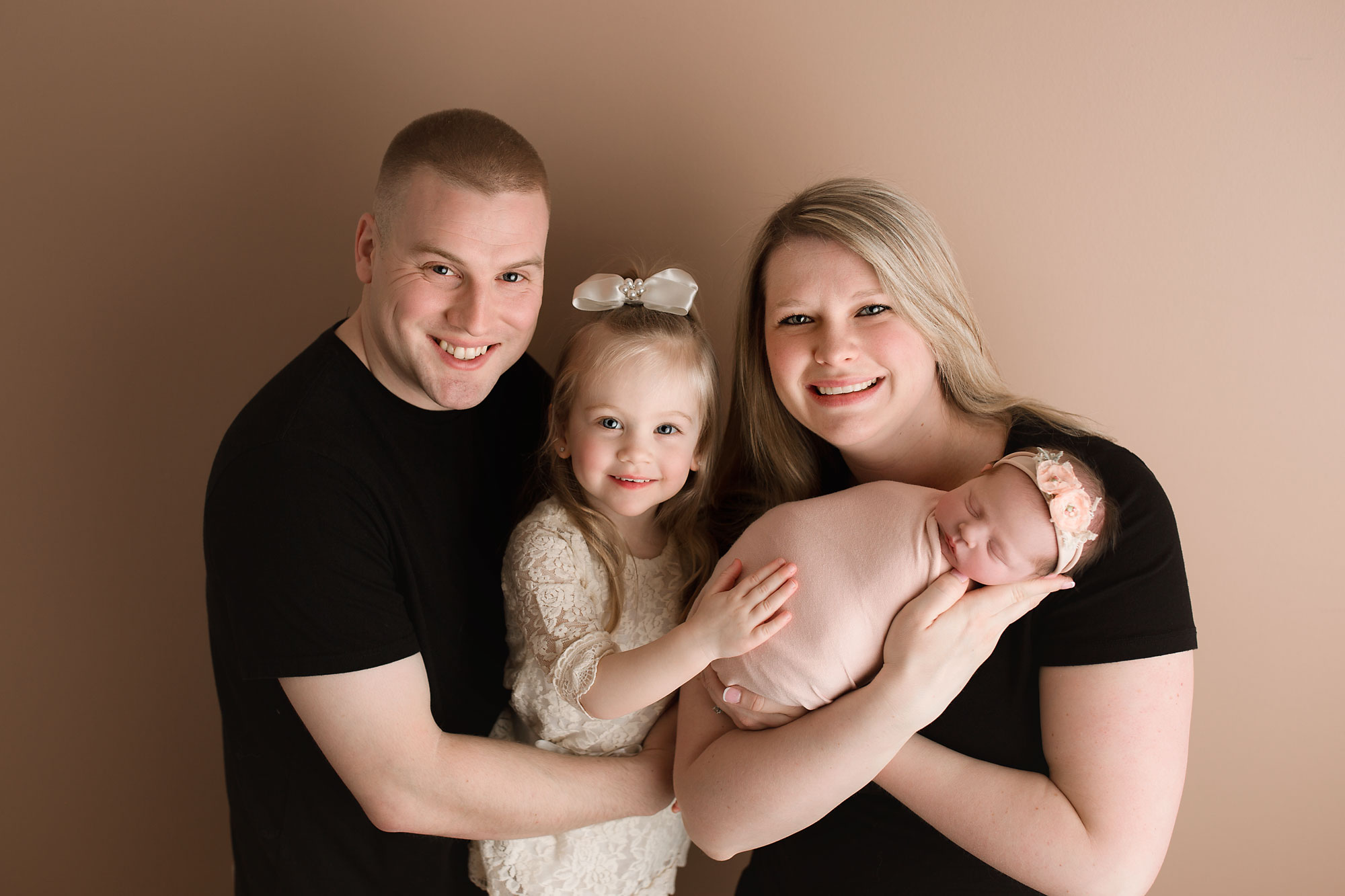 family photo with newborn baby swaddled in mom's arms. Morris county NJ newborn photographer , Yellow Lollipop Photography