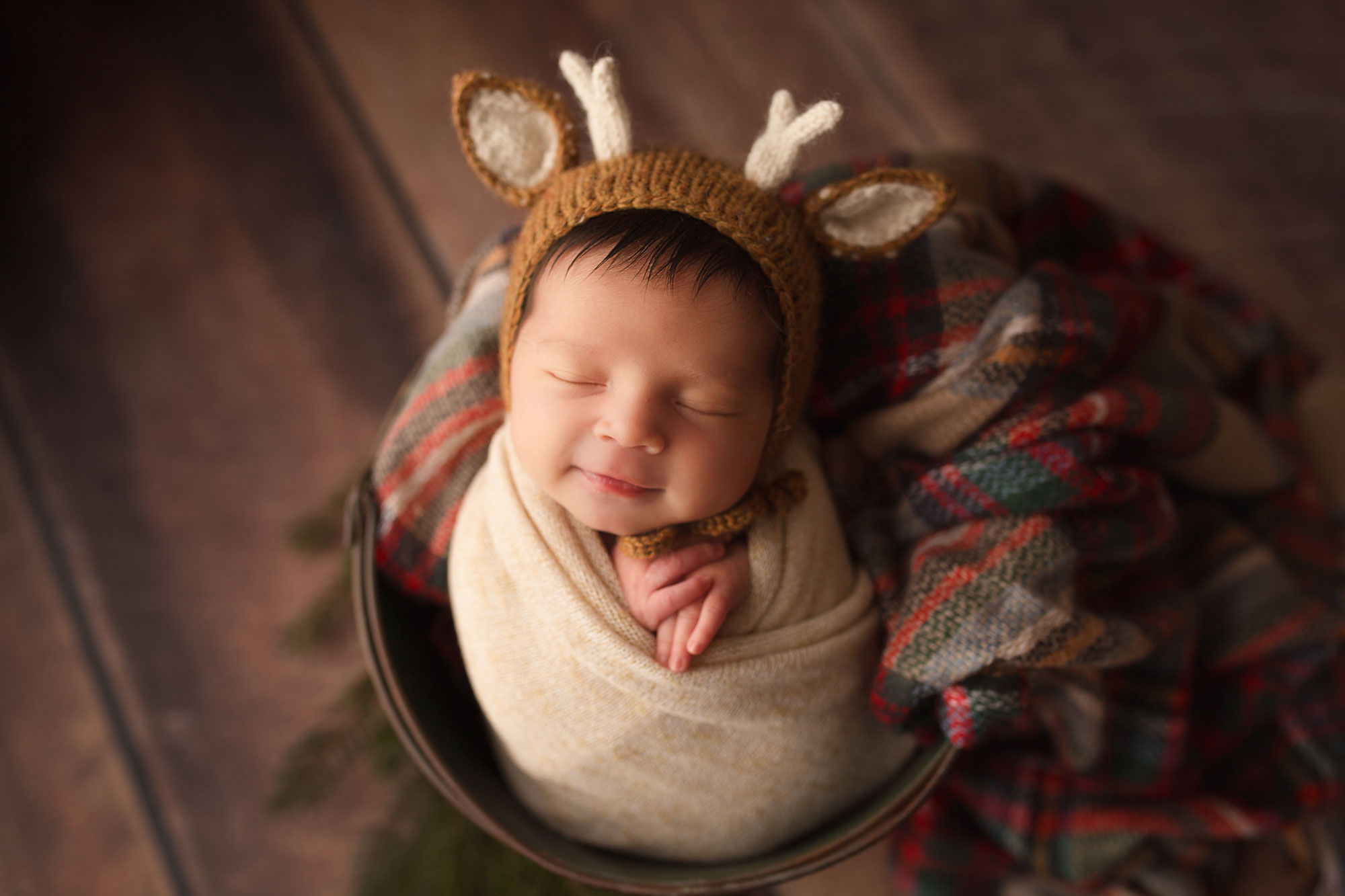 hunterdon county nj baby with a reindeer bonnet christmas set up