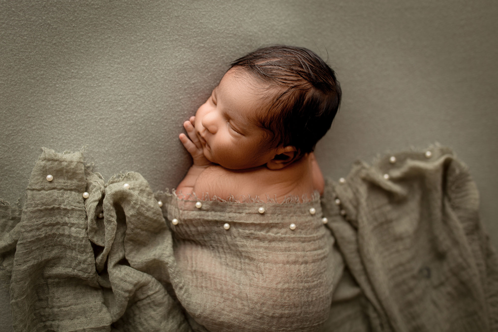 baby boy sleeping a sage colored fabric Somerset county NJ newborn photo session