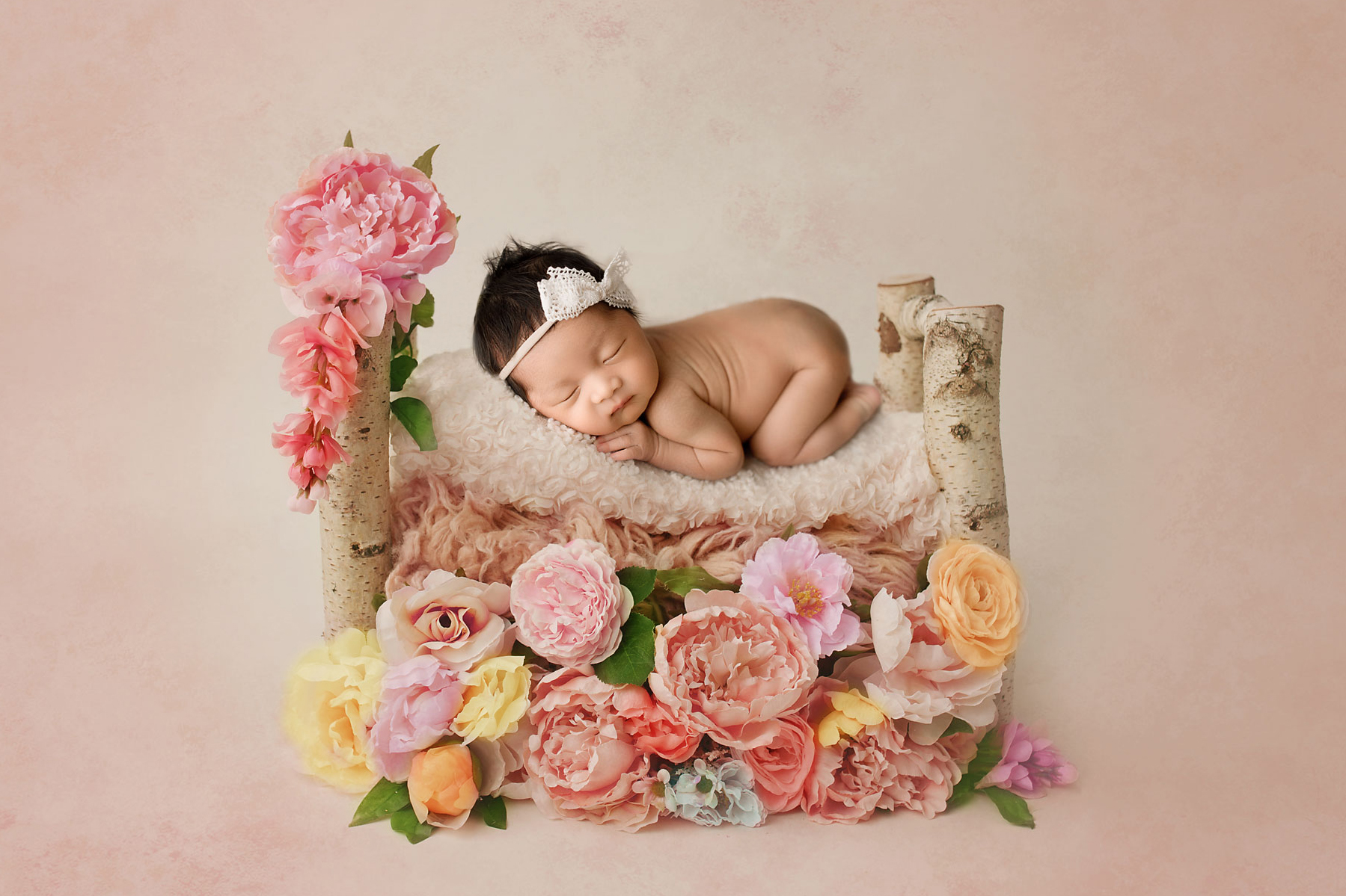 Newborn Photographer Bergen County NJ baby girl sleeping in a flower bed