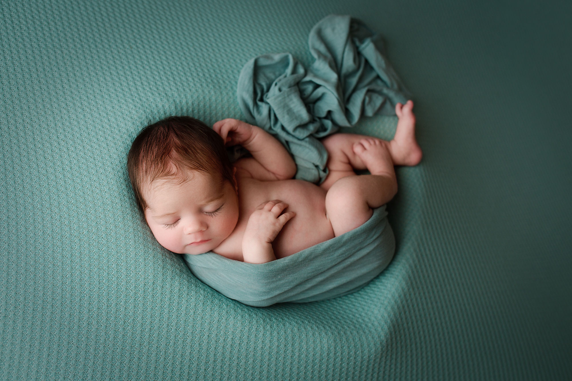 newborn baby boy photographed on a blue blanket, NJ newborn photography