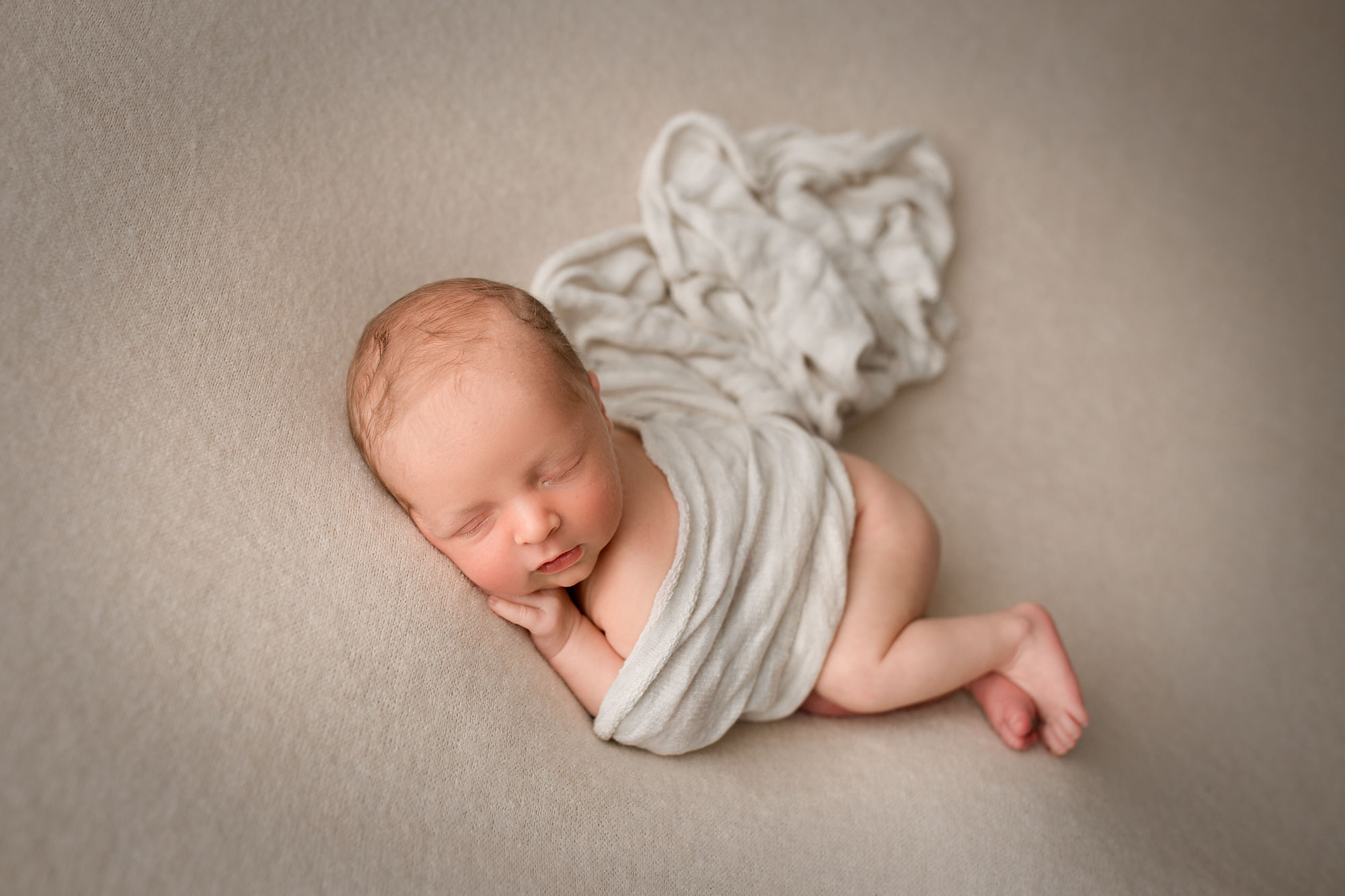 baby boy sleeping on a white blanket NJ newborn photographer