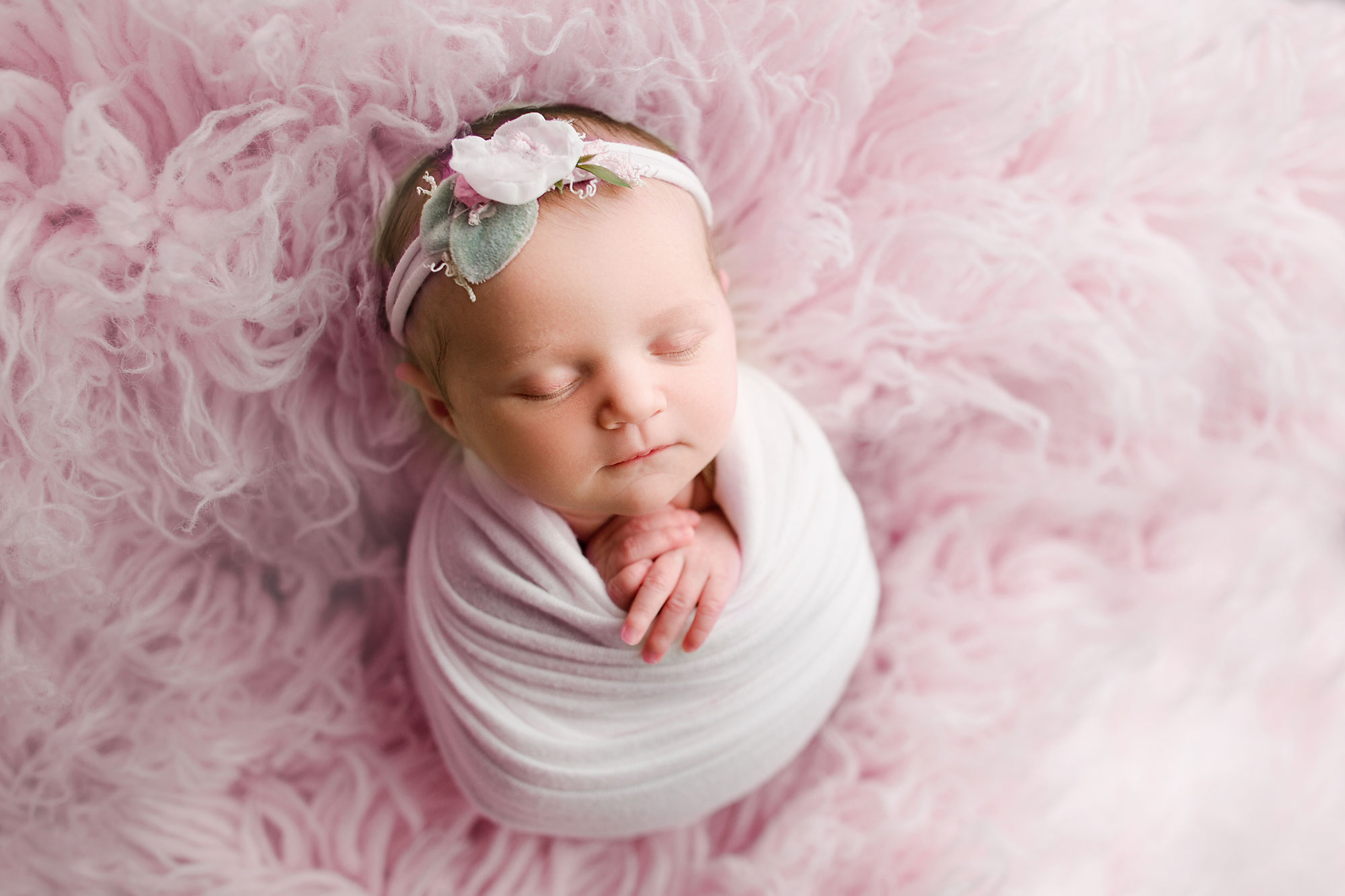 flemington nj baby girl sleeping on a pink flokati