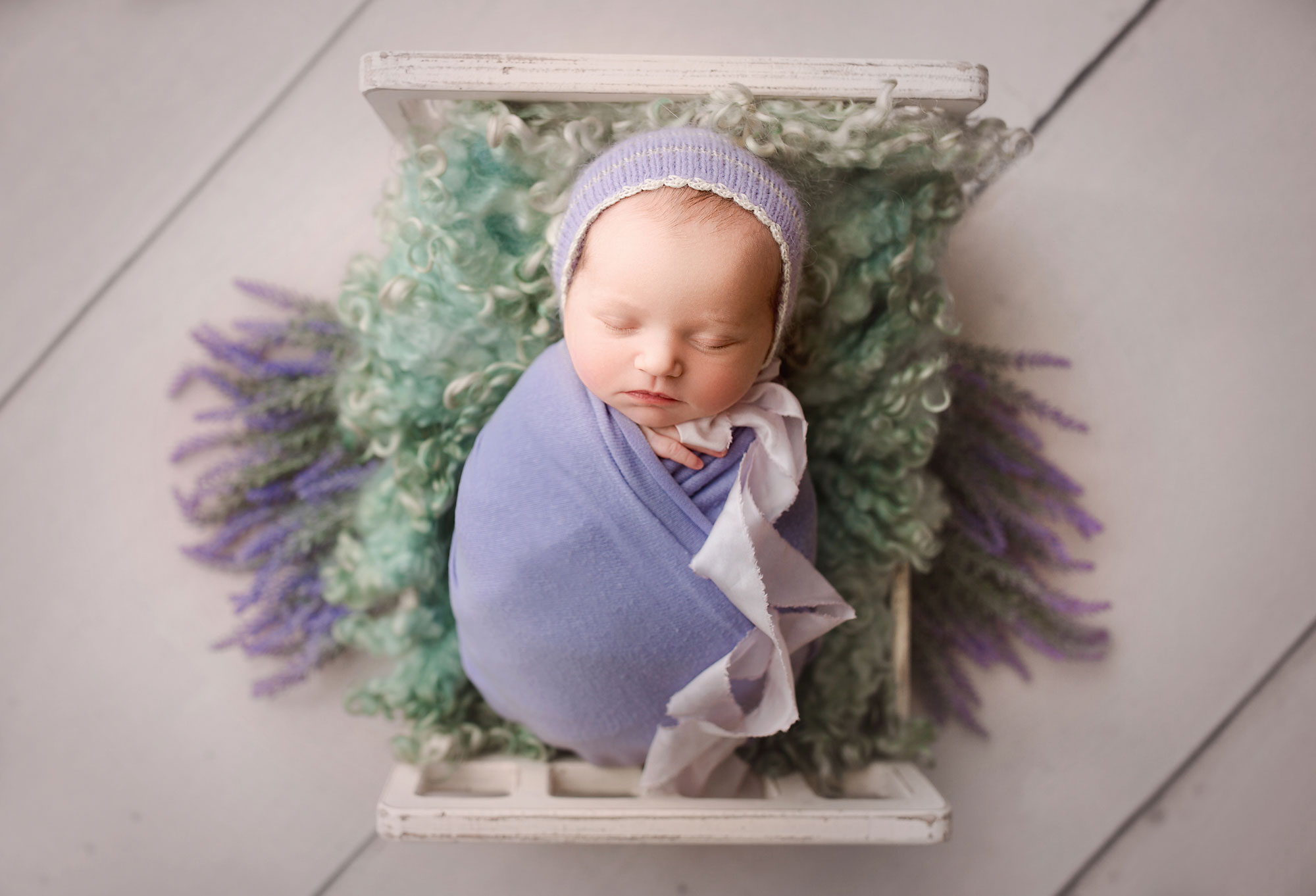 flemington nj newborn baby sleeping in a small bed lavender flowers