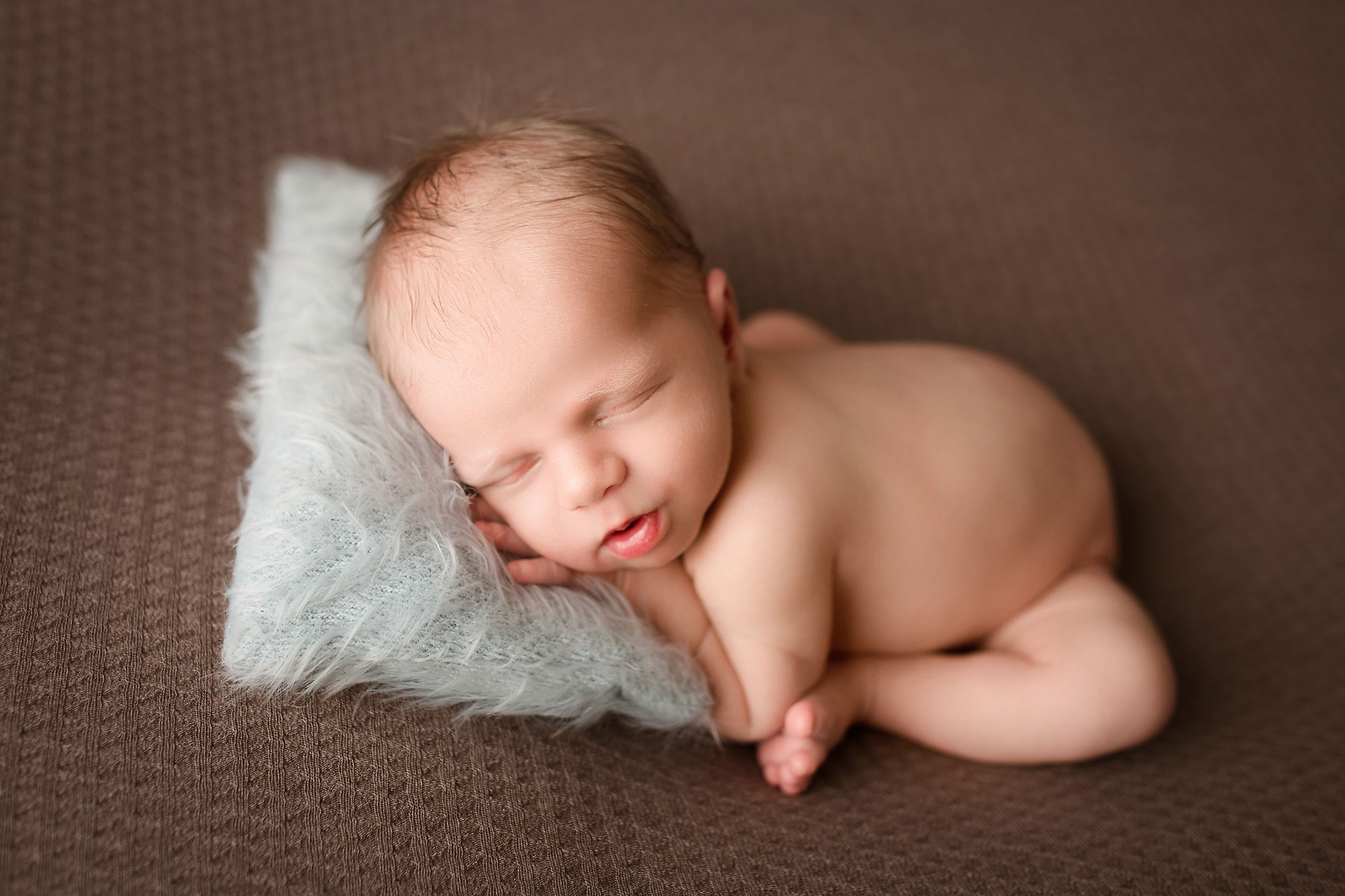 professional baby pictures bridgewater, naked baby asleep on fluffy pillow