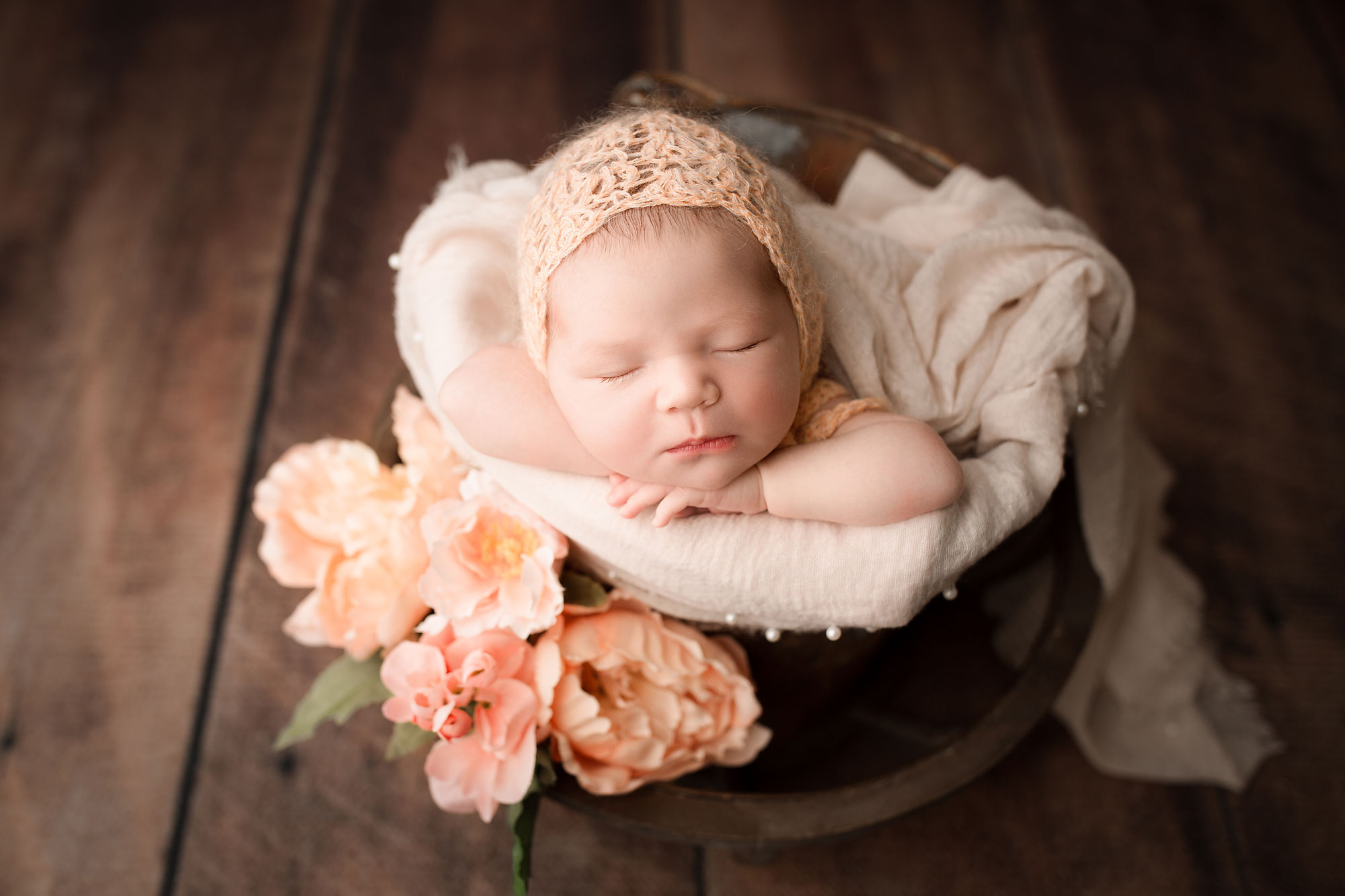newborn baby photo session Flemington NJ, sleeping baby with coral flowers and bucket
