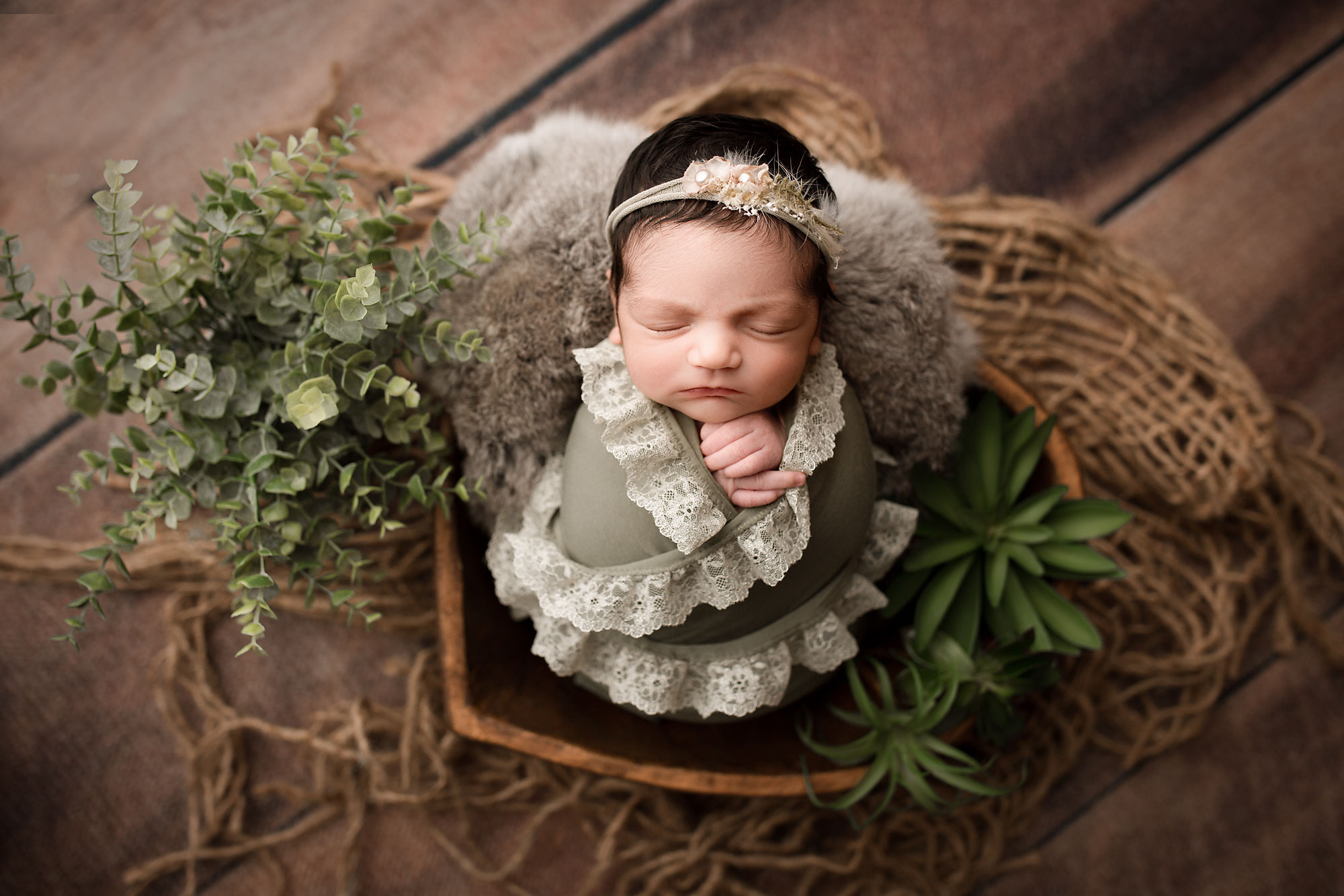 newborn baby photo session near morris county new jersey, baby girl in wooden heart bowl with plants