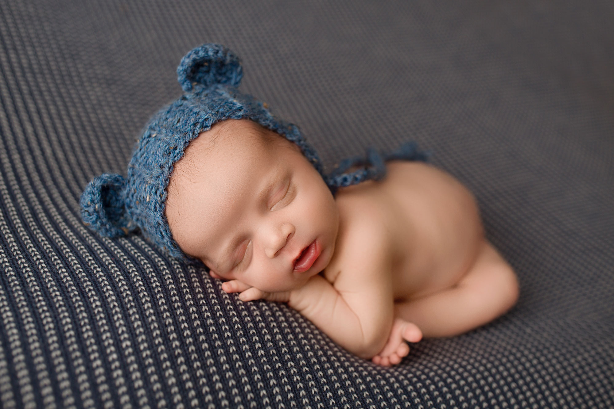 newborn photo session bergen county nj, sleeping baby boy in blue bear hat