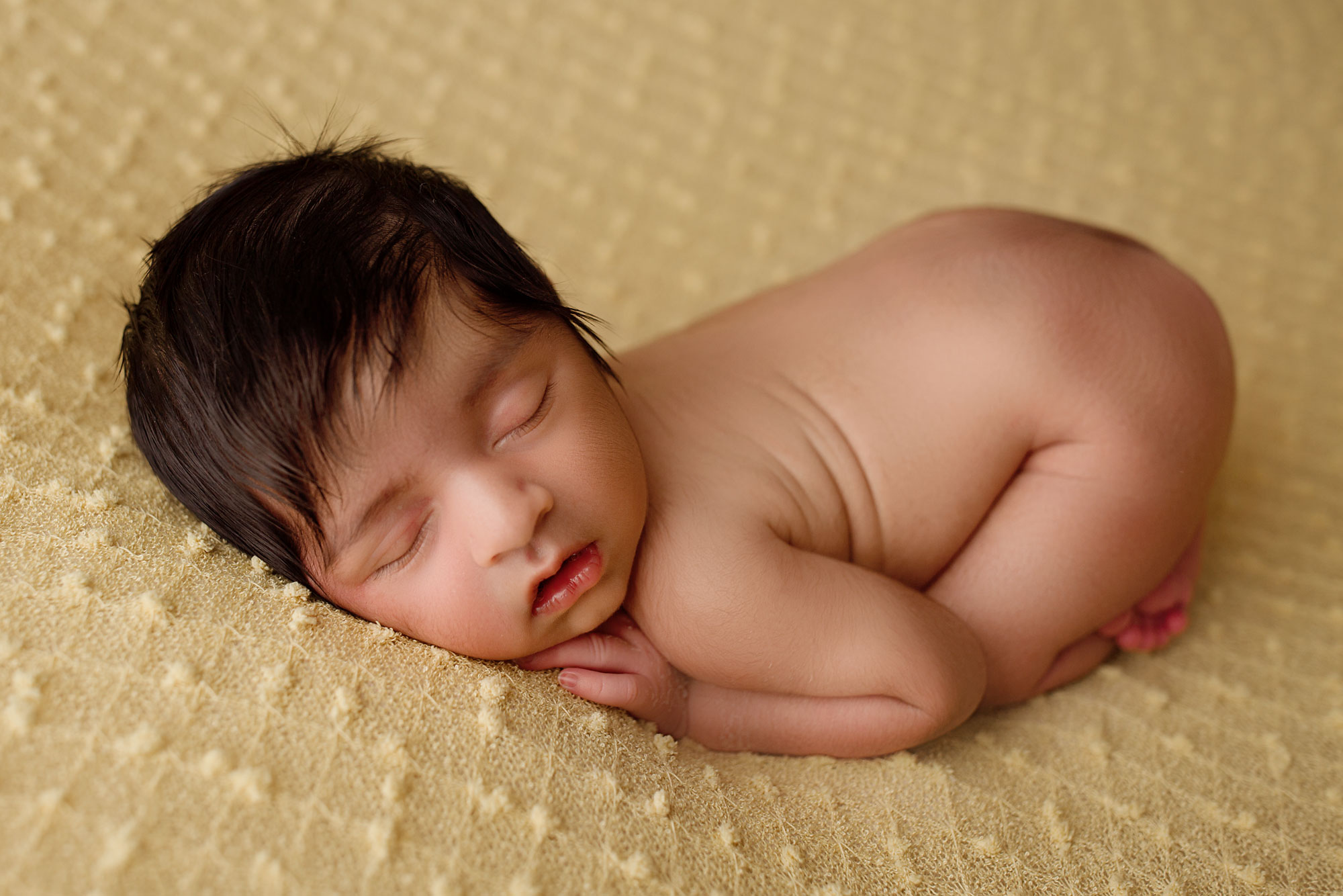 newborn photography new jersey, naked baby asleep on gold background