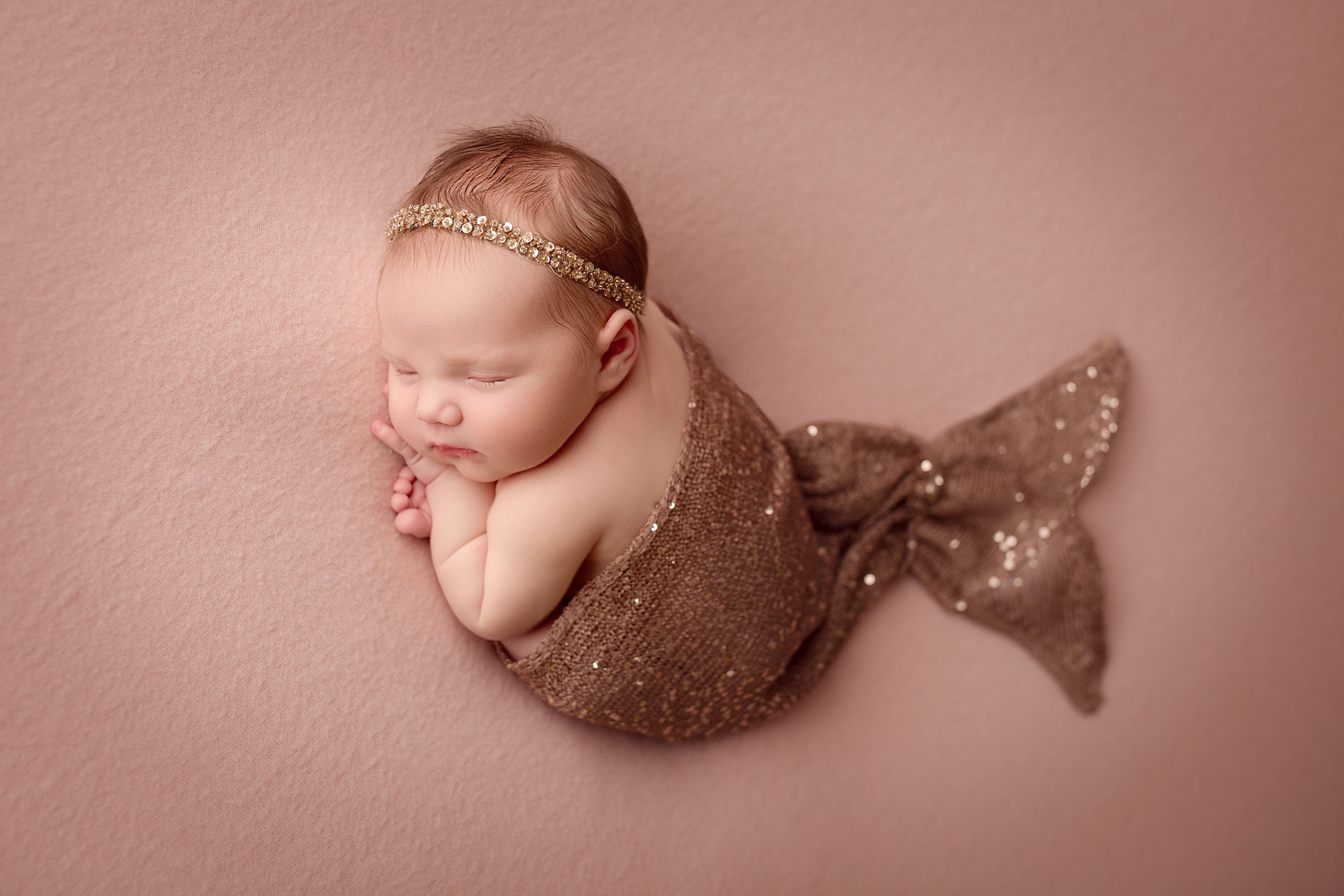 mermaid theme baby photos, newborn girl in sparkly mermaid tail and headband