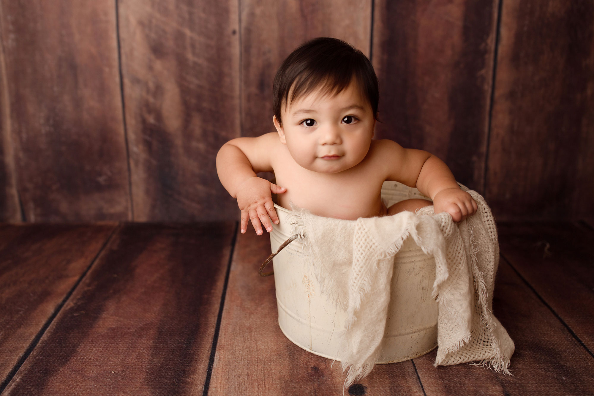 baby photo session union county nj, baby boy in rustic bucket against wood backdrop