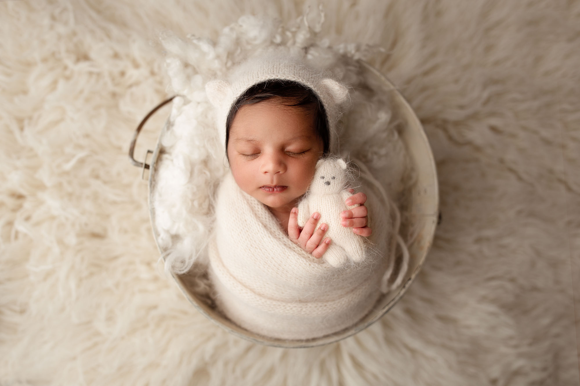 best baby photographers near pennsylvania, sleeping baby in white swaddle cuddling teddy bear