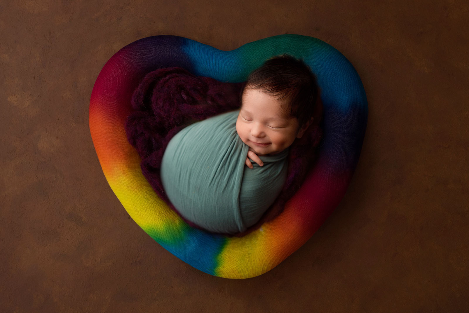 Creative photographs of newborn babies rainbow baby photos nj rainbow shaped heart ivf infertility success 