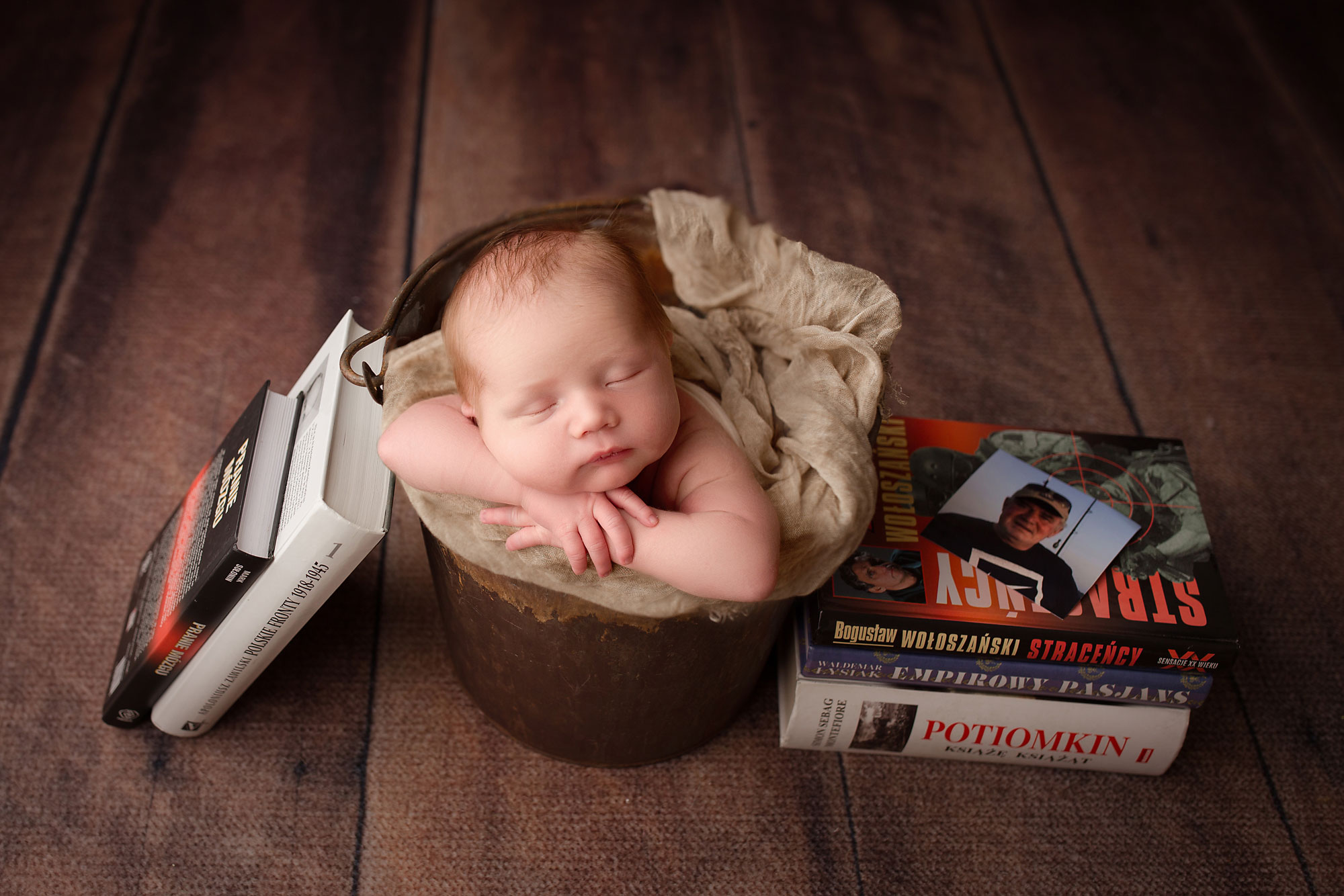 baby images, sleeping baby in bucket surrounded by books