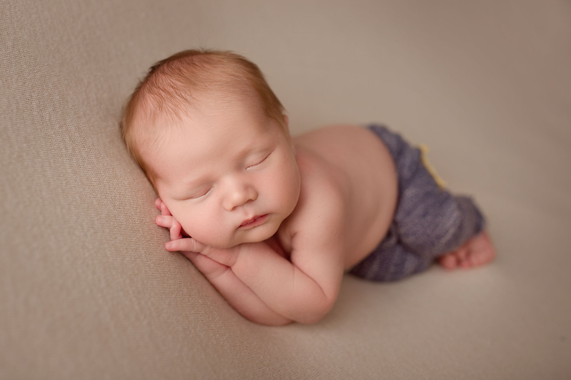 nj baby pictures, infant boy sleeping with hands clasped under cheek