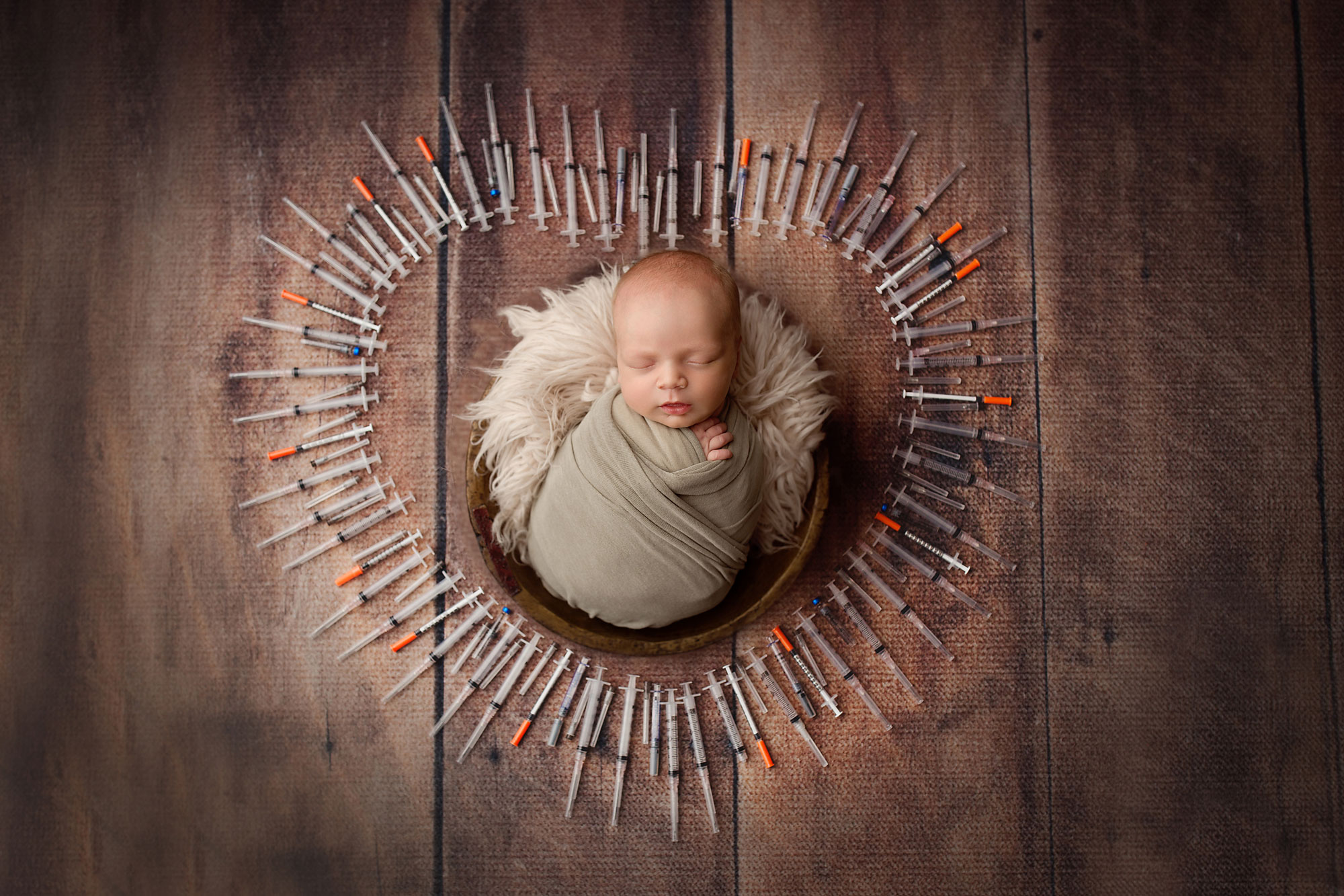 ivf baby pictures new jersey, baby sleeping in middle of heart made of ivf needles