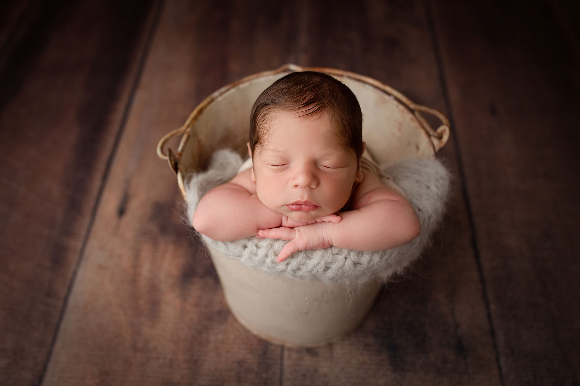 morris county newborn photo session, baby boy asleep in rustic bucket