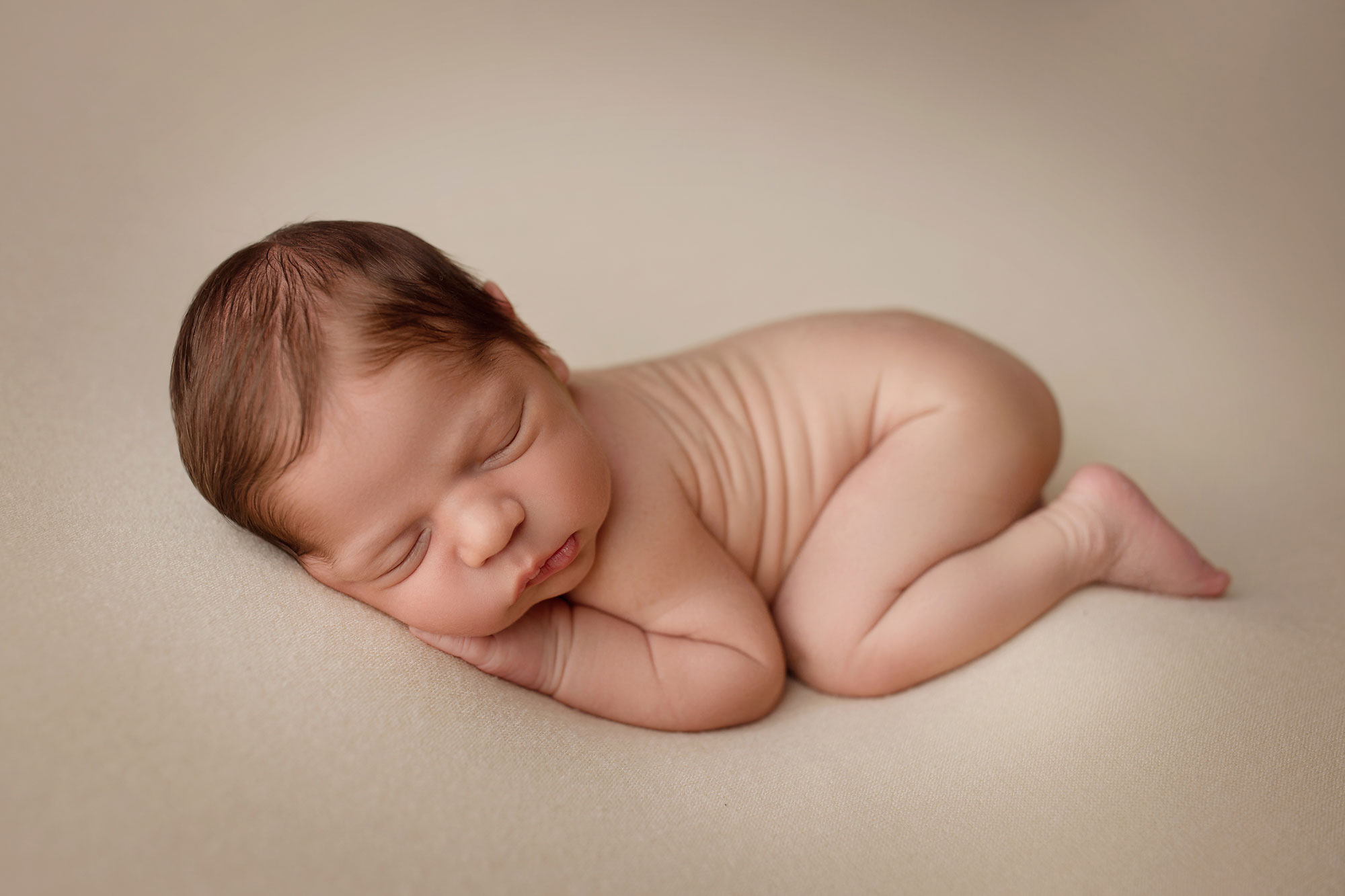newborn portraits new jersey, naked baby asleep on neutral backdrop