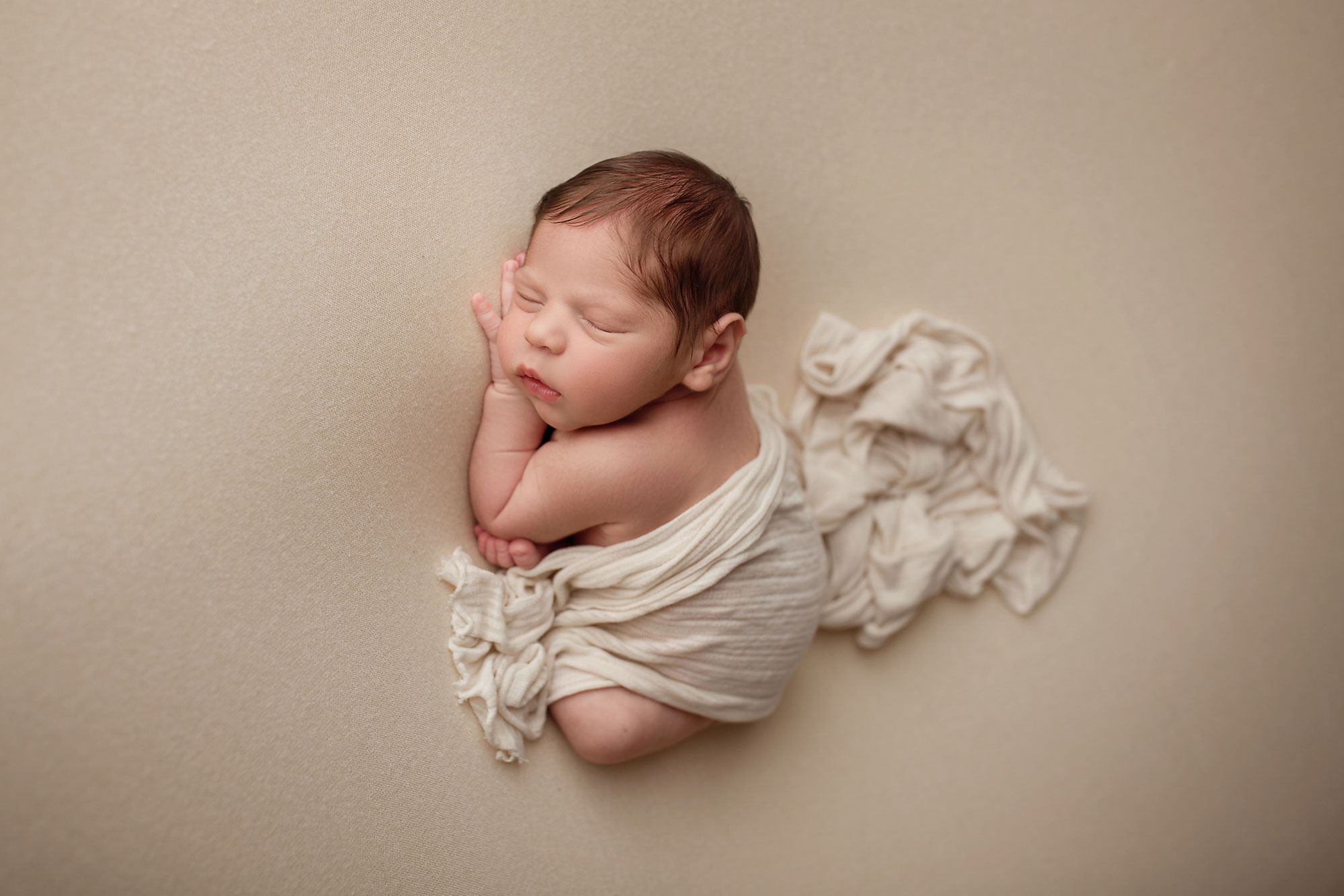 morris county newborn pictures, baby boy asleep on neutral background with blanket