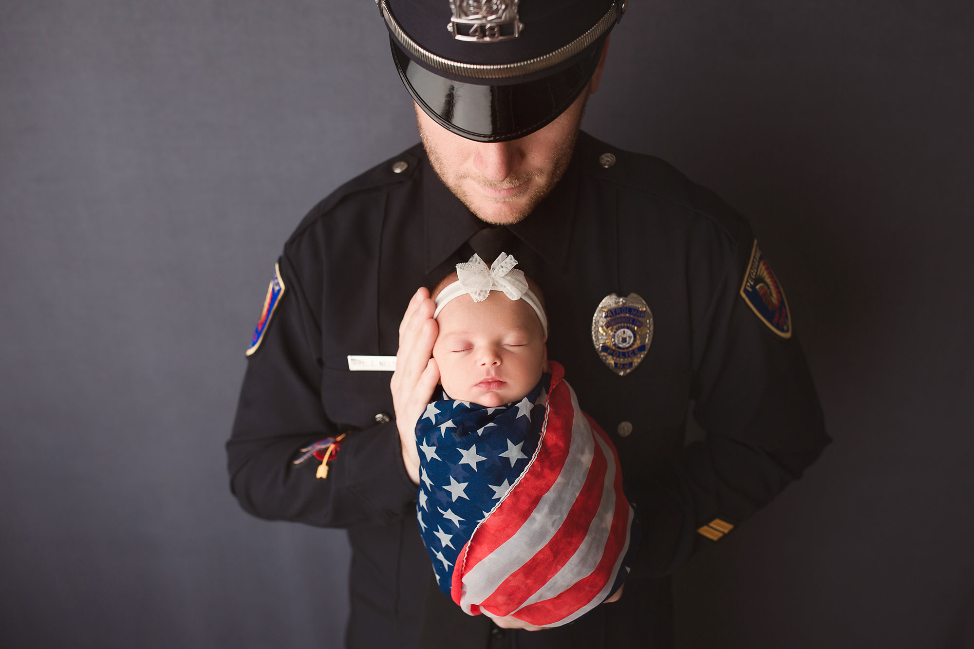 police officer and newborn family baby photography session