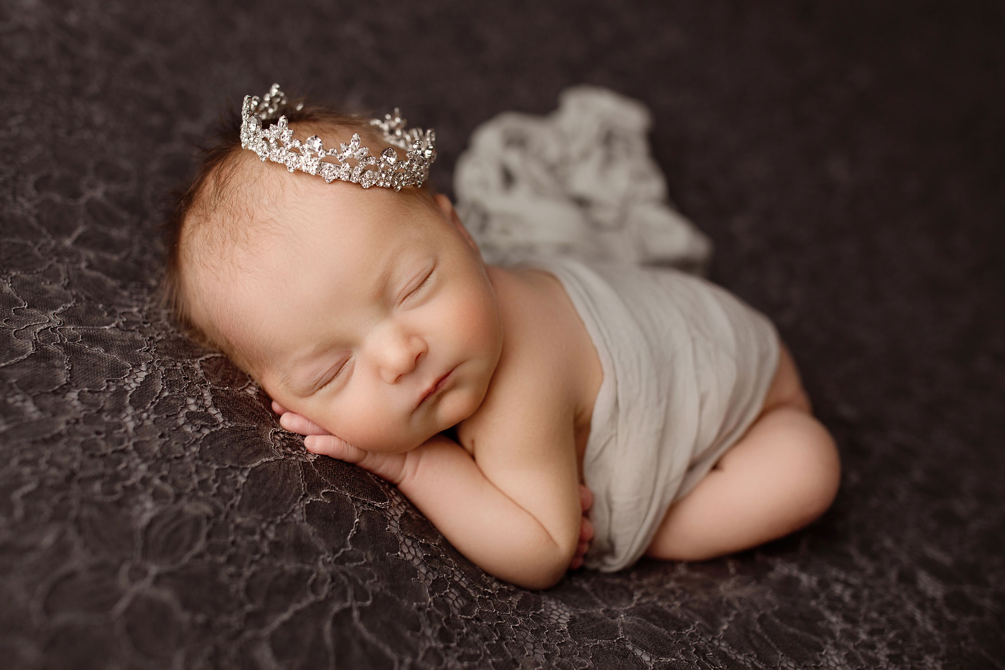 baby girl newborn photography long valley, baby in wrap and tiara sleeping on dark textured background