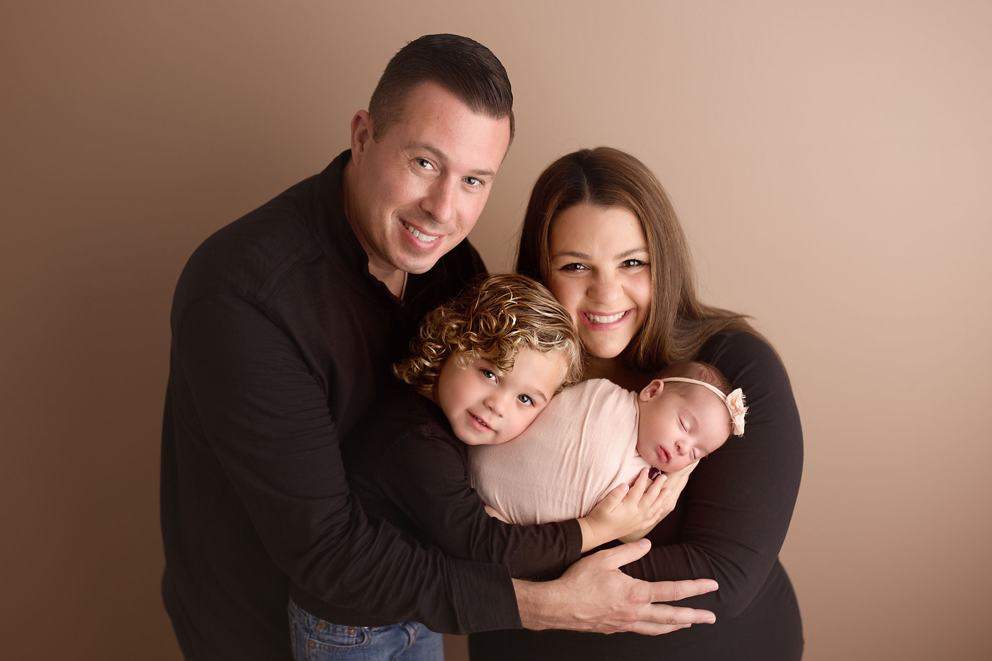 new jersey family portrait, parents and big brother holding newborn baby girl