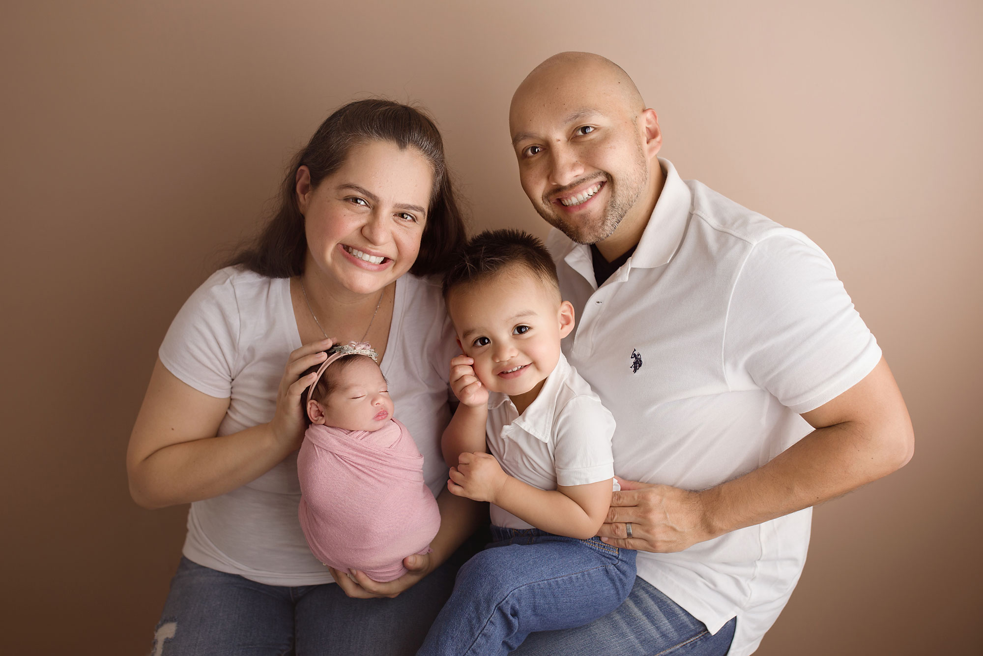 happy family newborn photography with older sibling