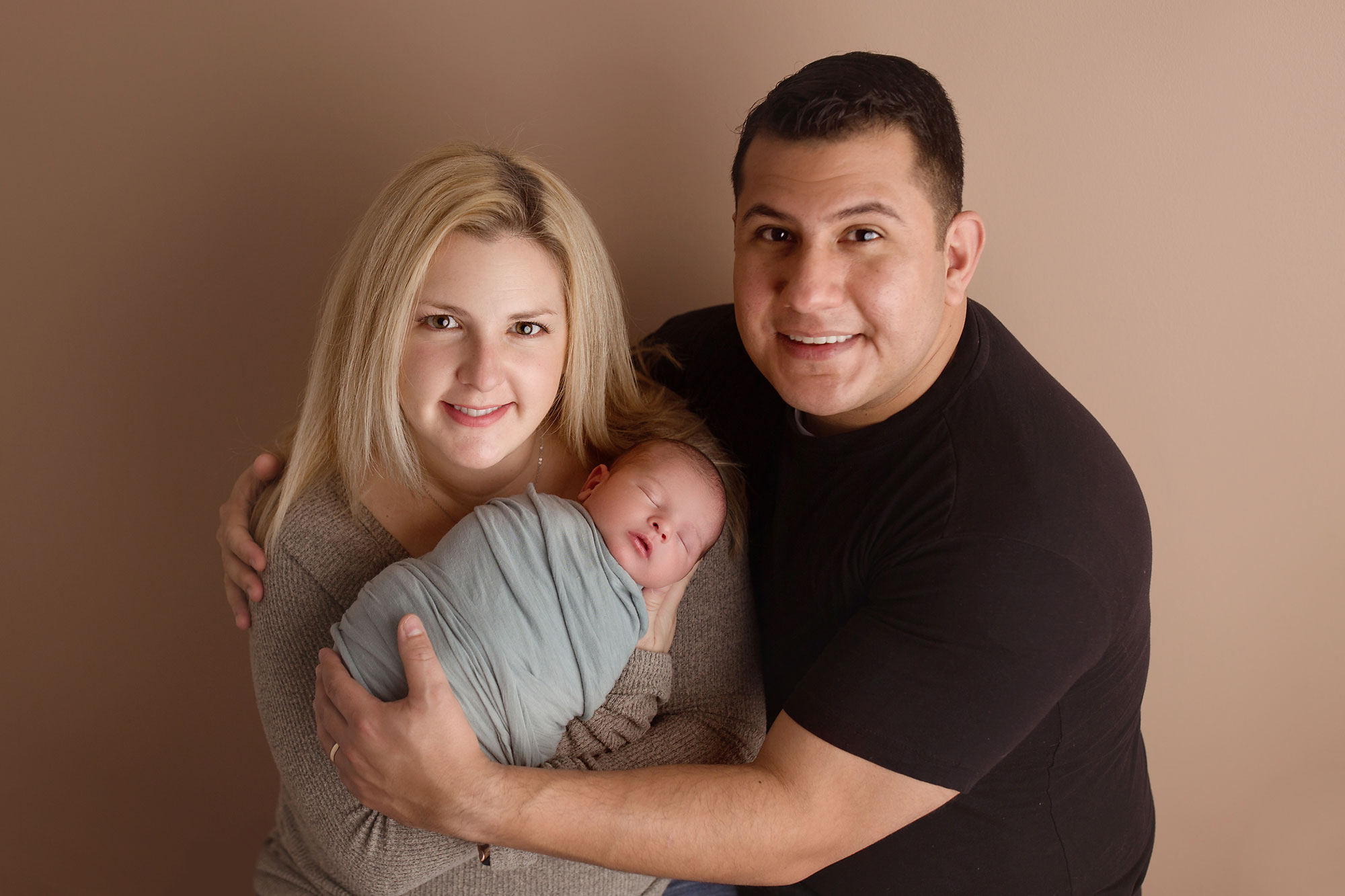 baby and family pictures new jersey, parents holding swaddled baby boy