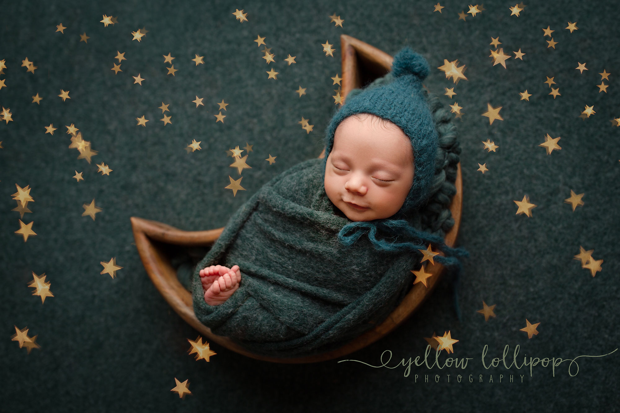 Newborn Mini Photography Sessions baby boy sleeping in a moon shaped prop