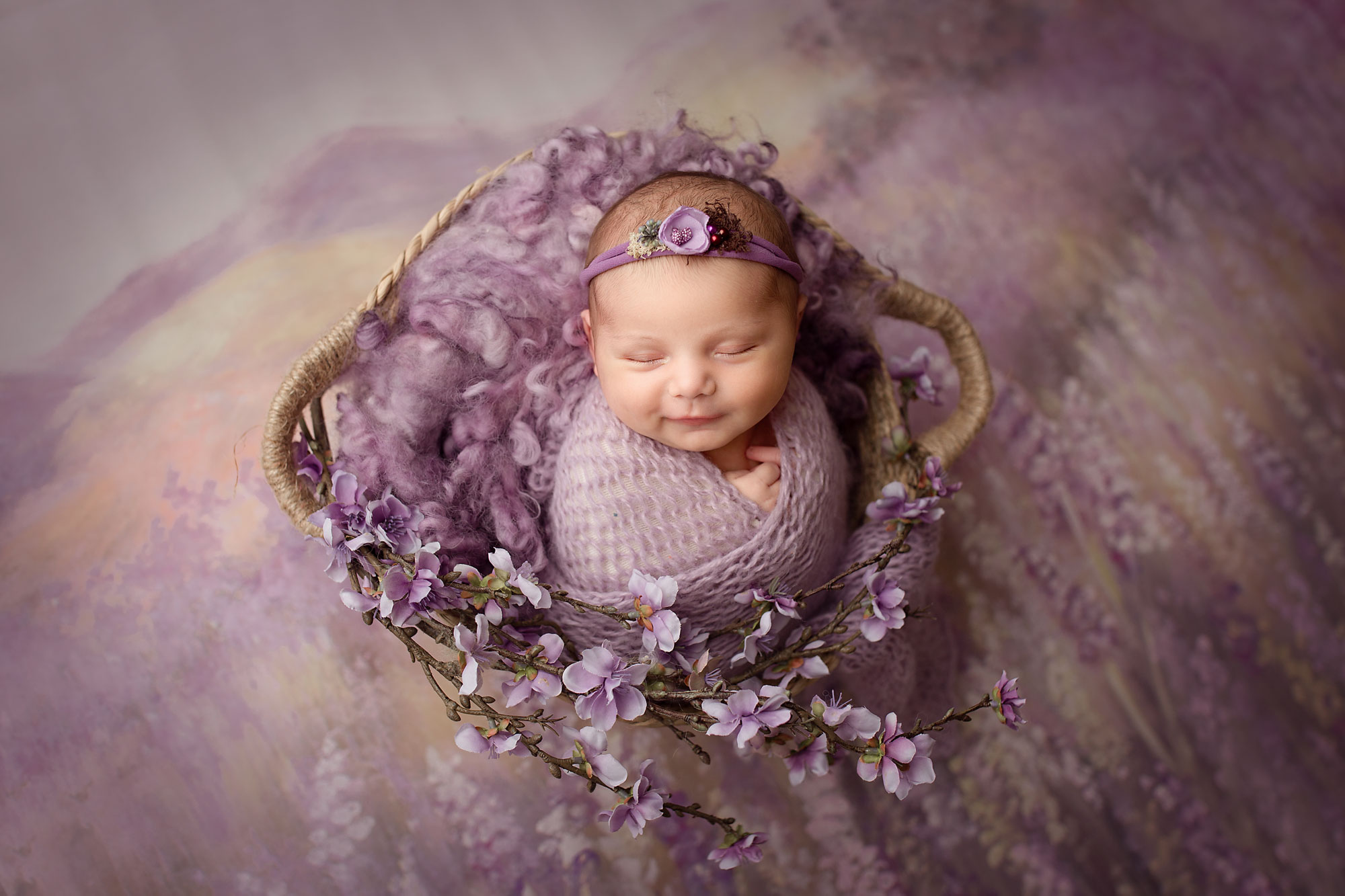 baby girl in purple with lavender background