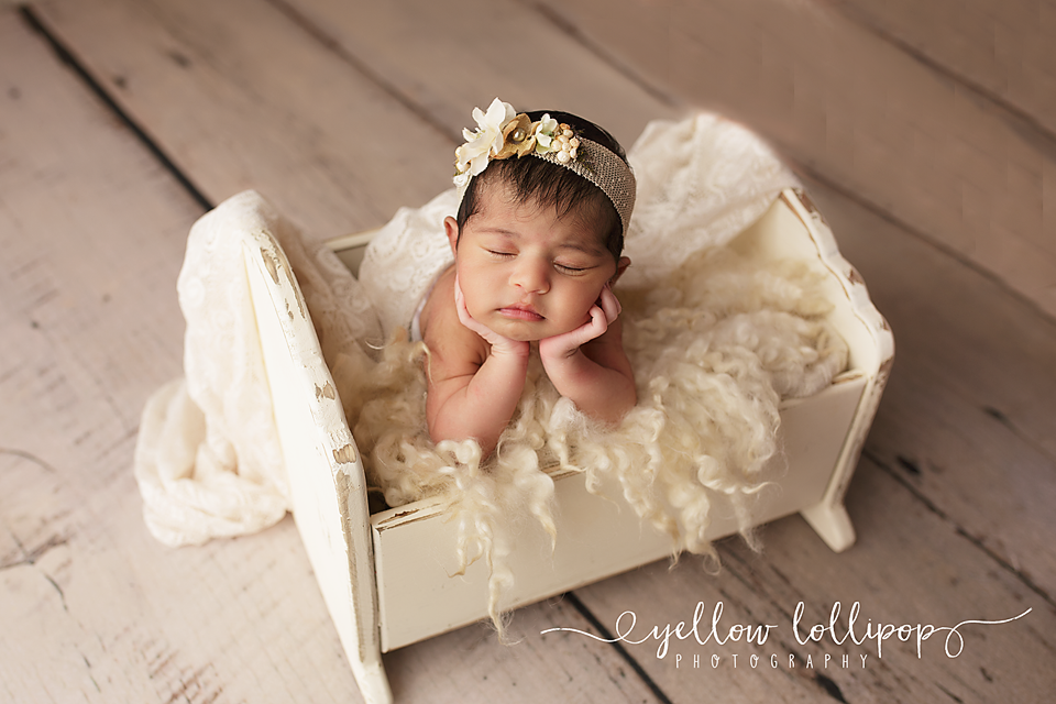 best NJ newborn photographer baby girl in a wooden cradle