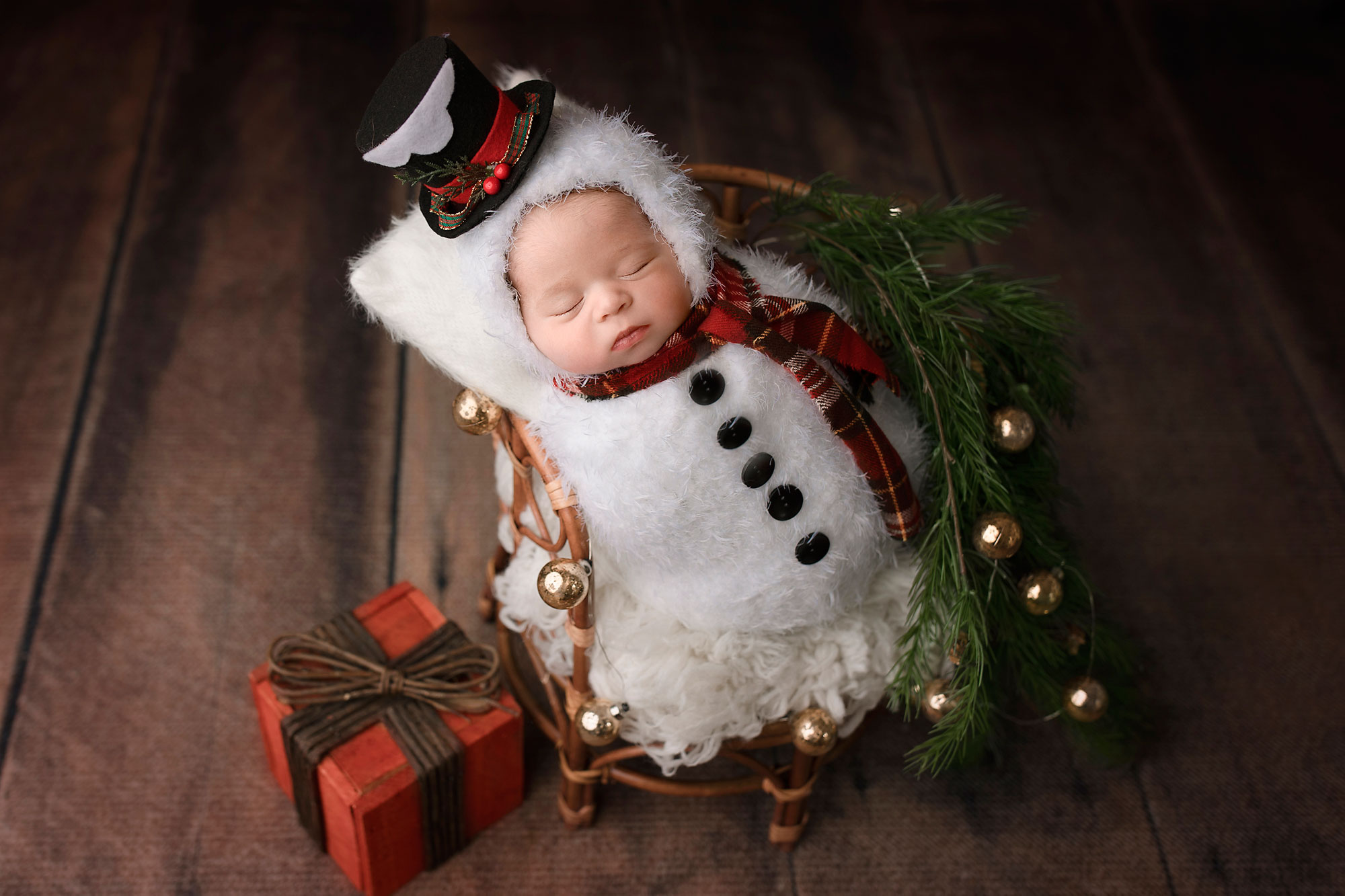 newborn baby dressed like a snowman