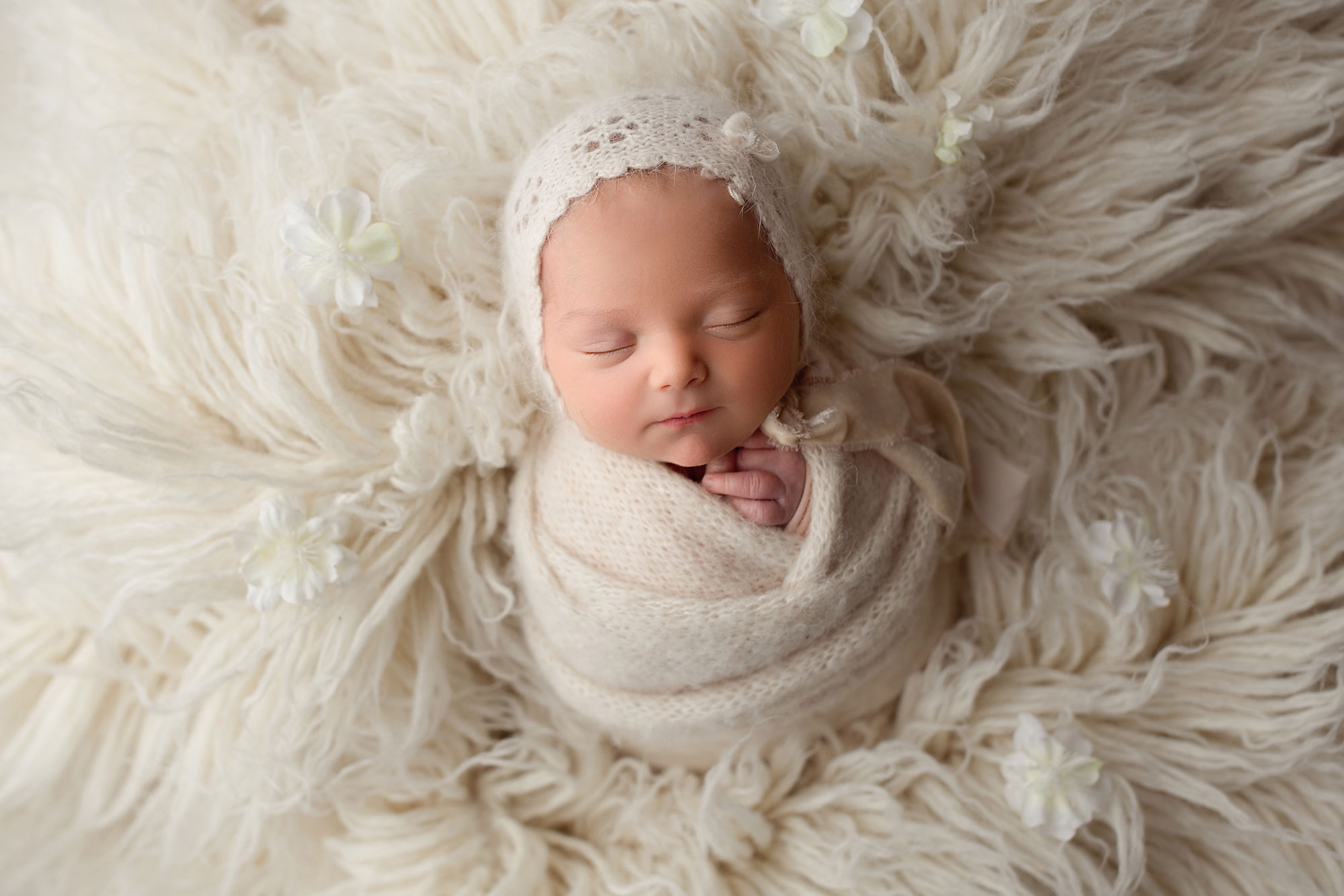baby girl sleeping on a flokati NJ newborn photography Swaddled Newborn Photos