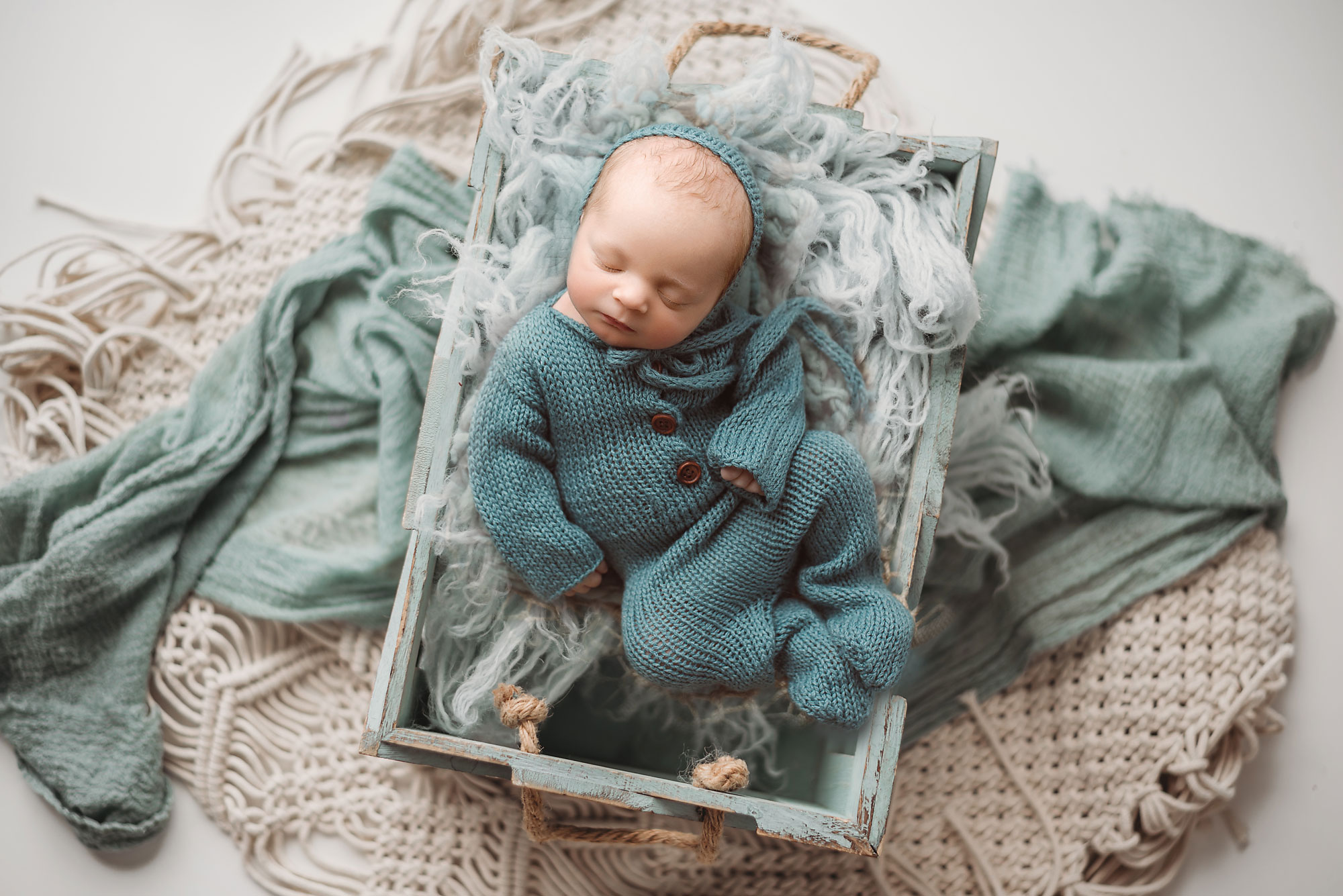 newborn baby in a basket photographed by top NJ baby photographer