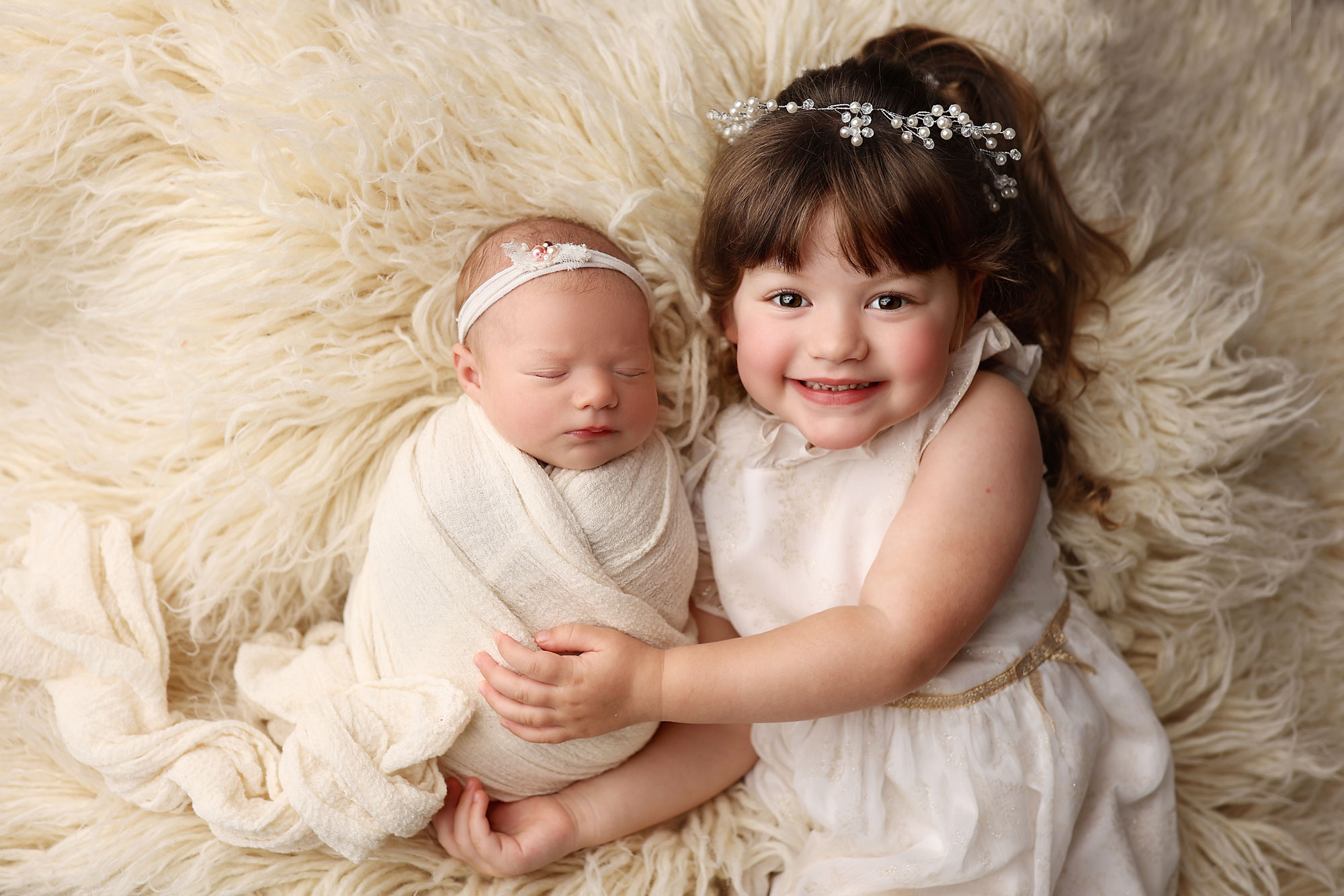 siblings during newborn photo shoot