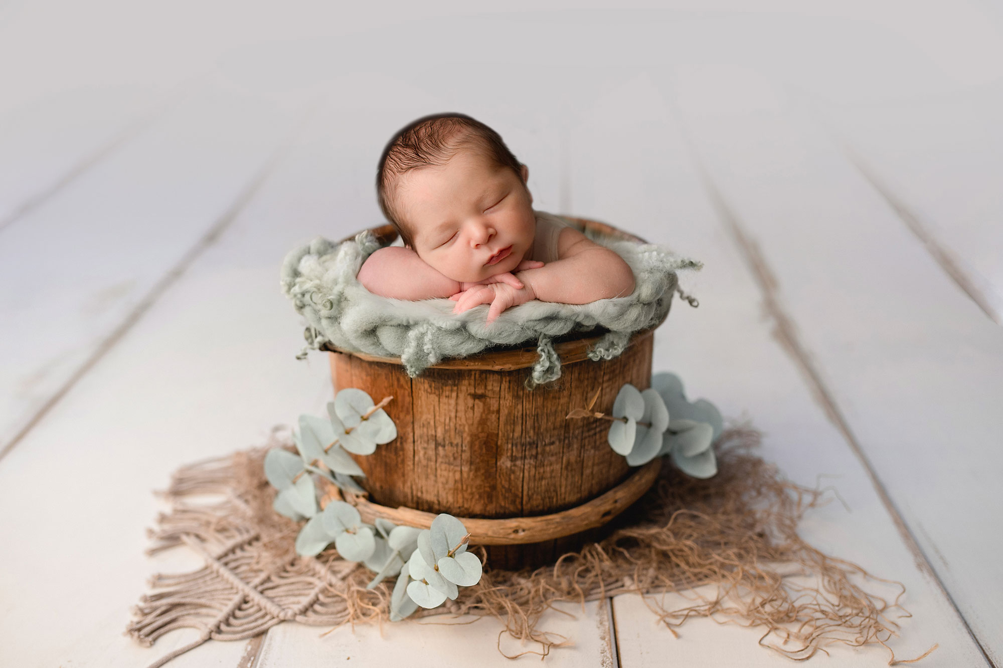 baby boy in a bucket during his Chester NJ newborn photography session